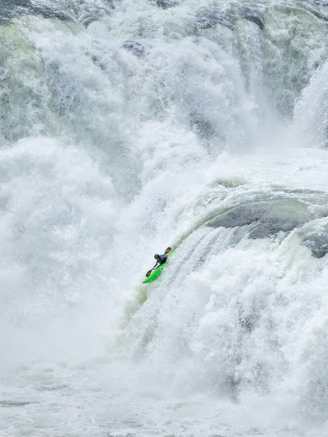 James Shimizu kayaking Lower Mesa Falls on the Henry's Fork River in Idaho.