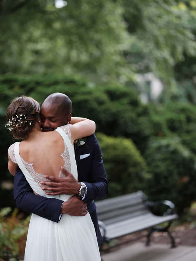Professional photographer, Alison Conklin, on why the FUJIFILM GFX system is so good for location portrait photography. Image of a bride and groom hugging on their wedding day, taken at a dutch angle.