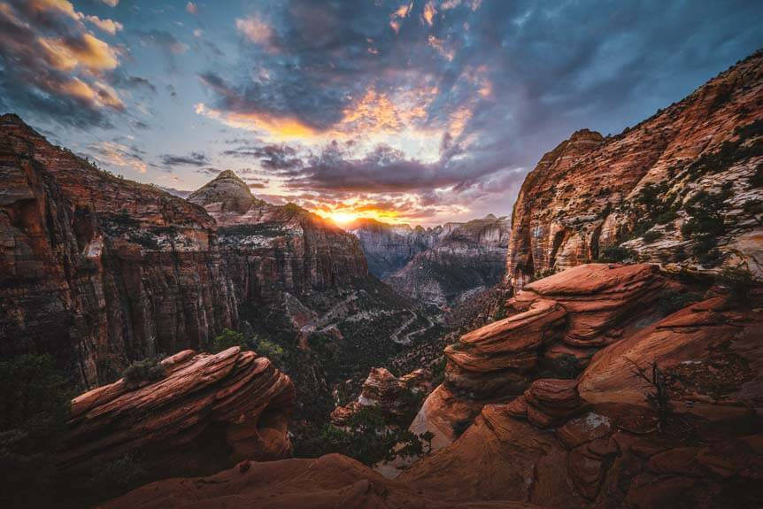 Sunset beyond vast canyon