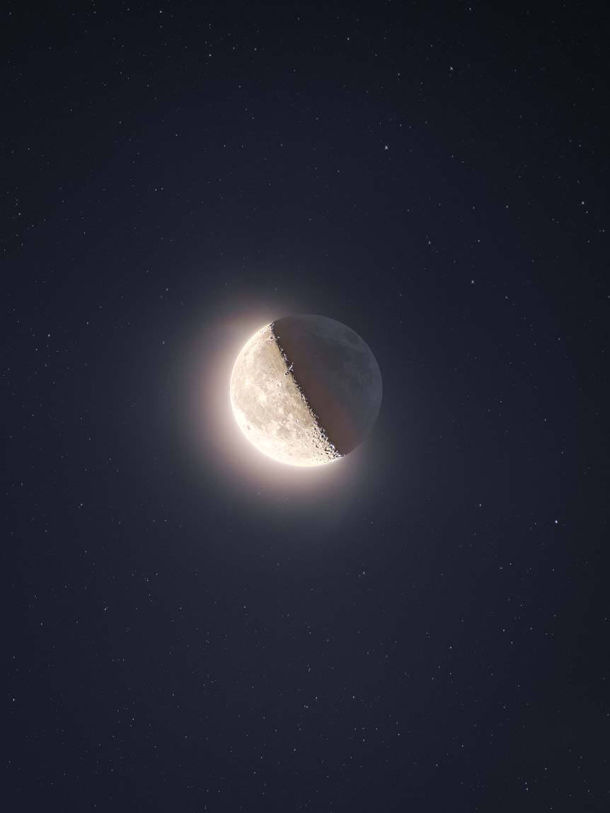 Moon half lit and half in shadow