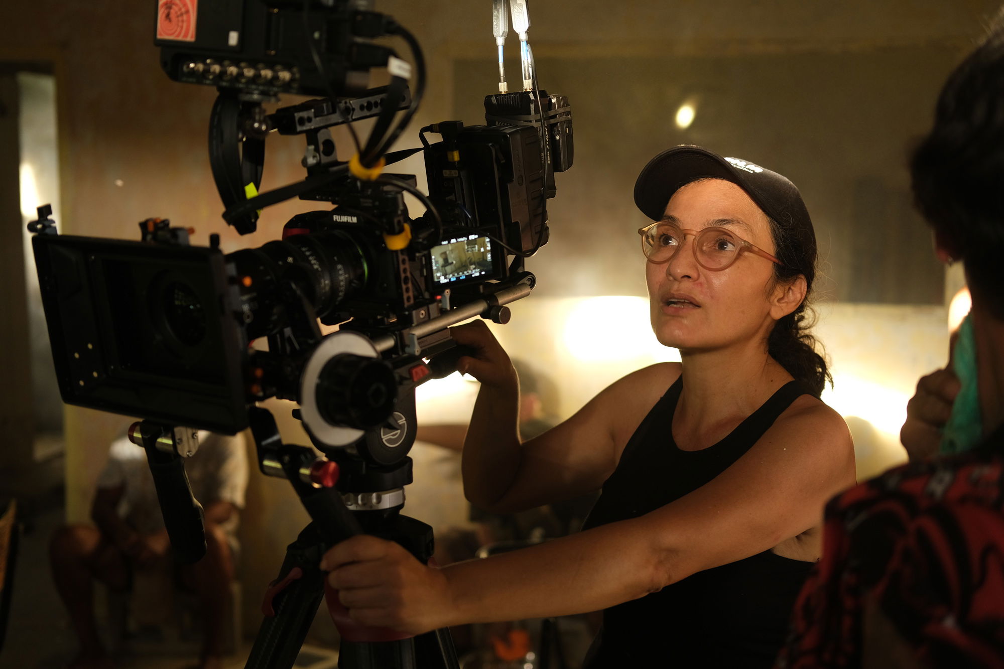 A female cinematographer preps her next blocking