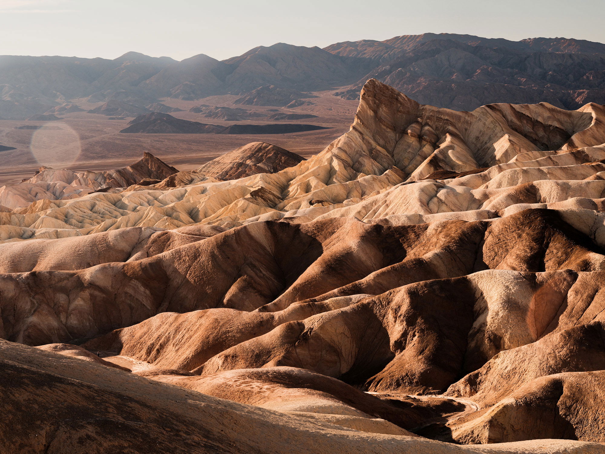A collection of contorted sand dunes, wide and long