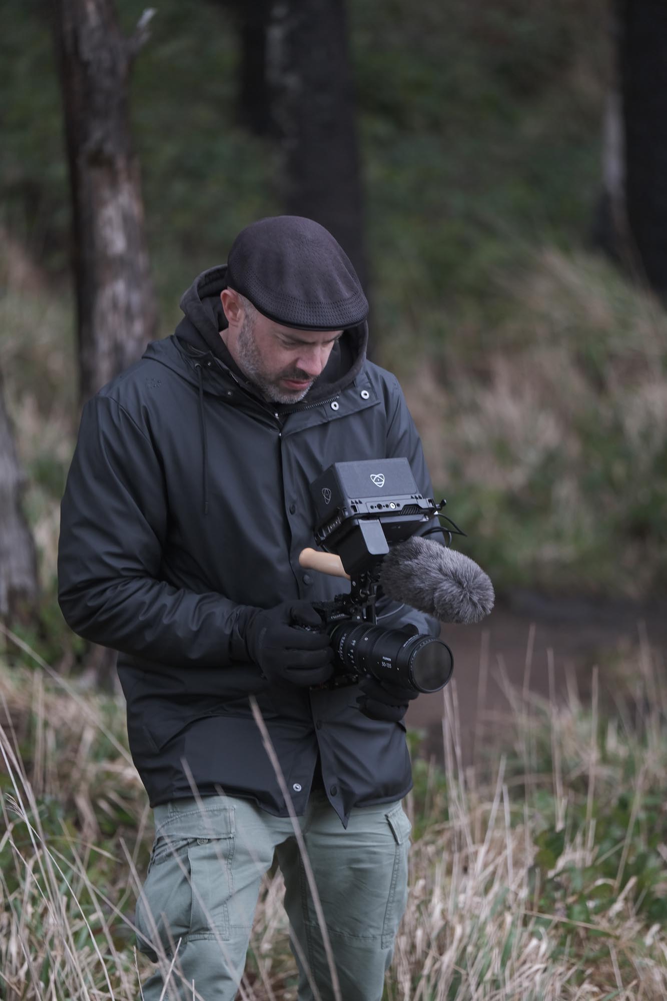 A man trains his X-H2S on a subject out of frame