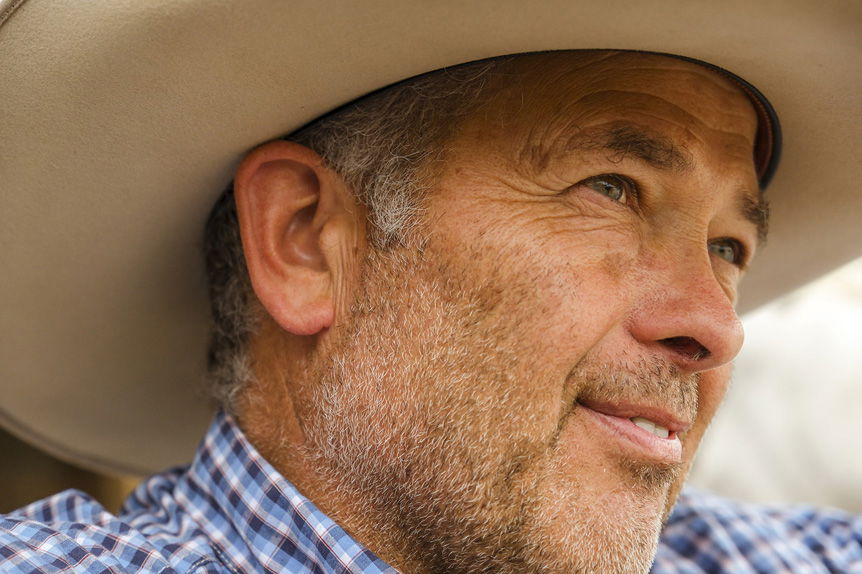 Gray-haired man in cowboy hat