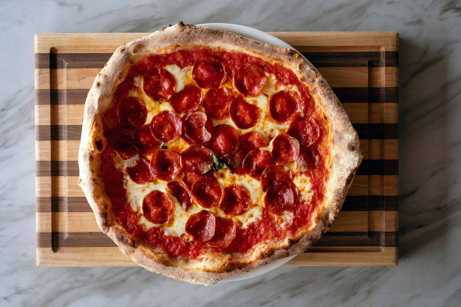 flat lay photo of pepperoni pizza