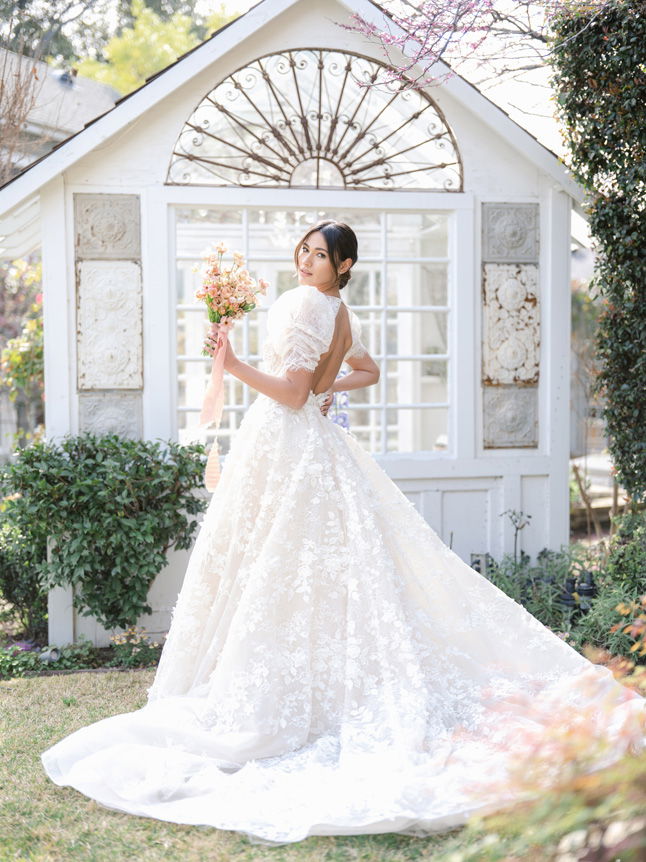Woman in white wedding dress holding bouquet