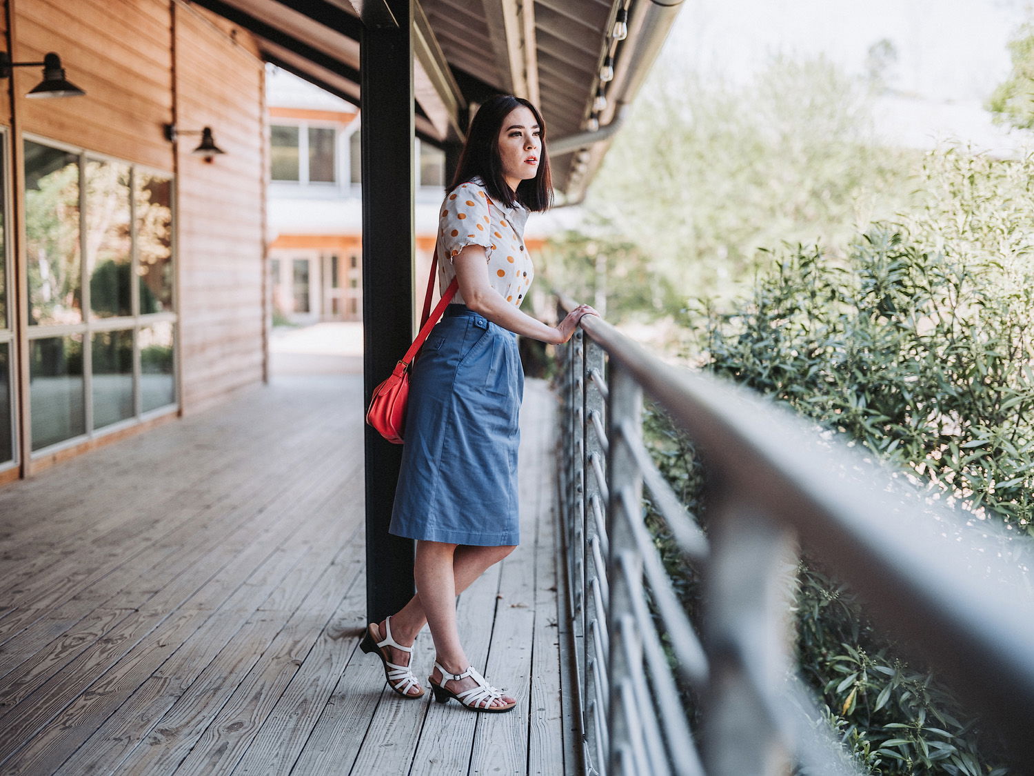 Woman looking over balcony