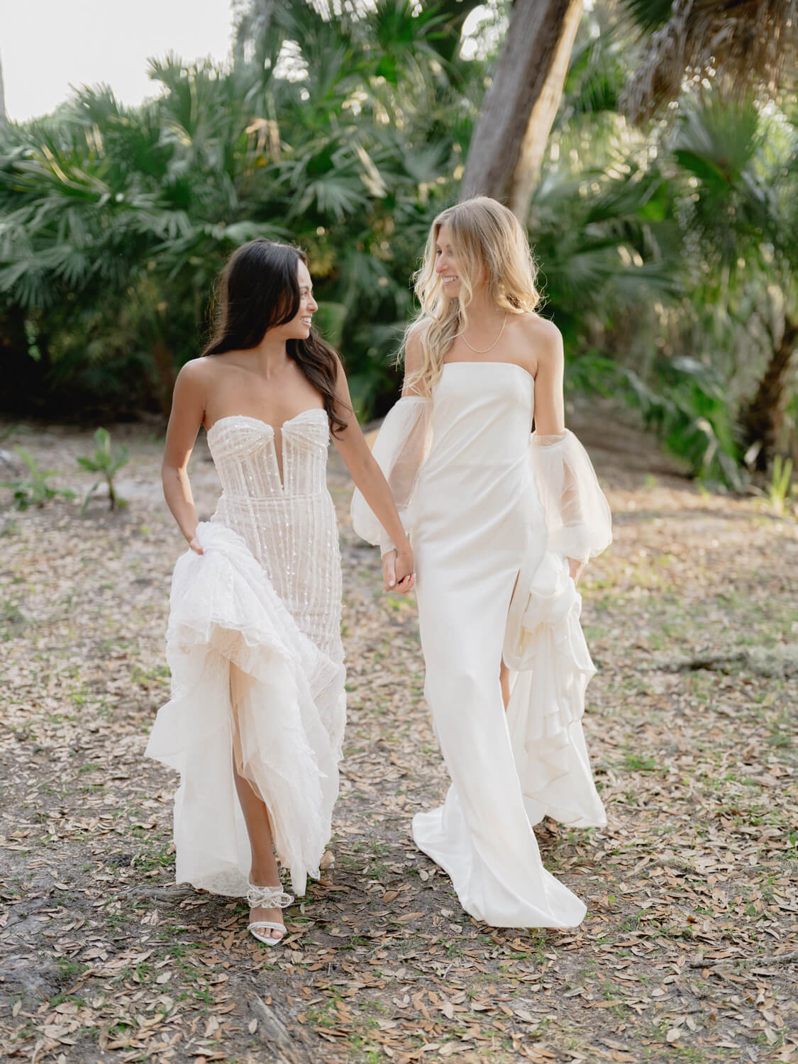 Brides walking together in forest setting