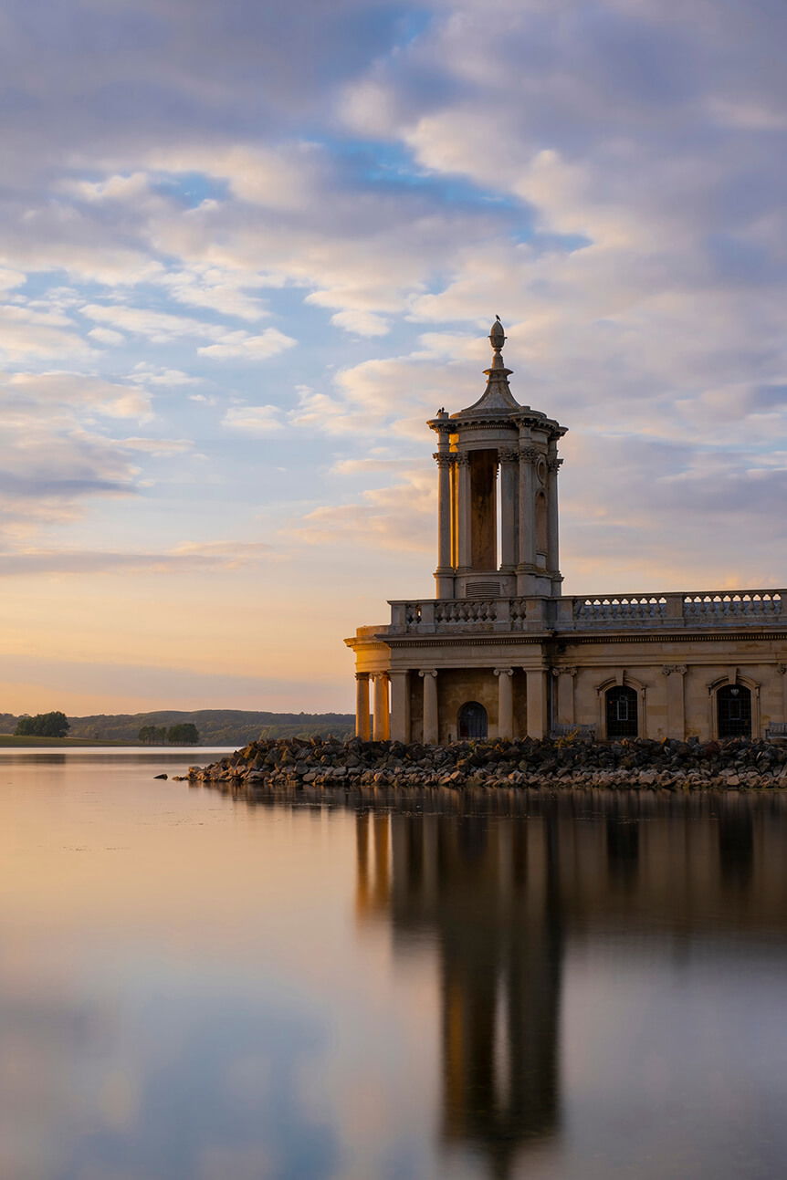 Small, historic building in a lake, seen from mid range